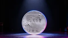 Stříbrná mince 5000 Kč s motivem běžců, česká numismatika, sportovní medaile.